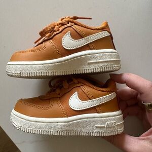 Nike Kids' Air Force 1s Orange Low-Top Sneakers with White Swoosh